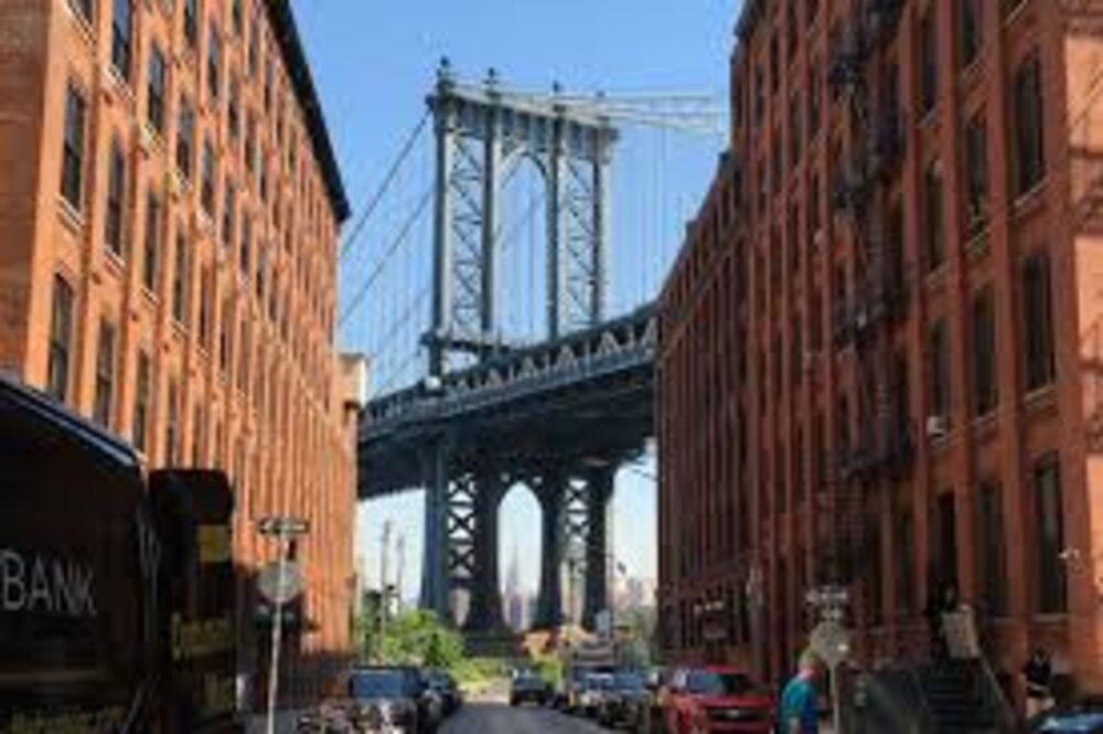 DUMBO Manhattan Bridge view from cobblestone Brooklyn streets — Williamsburg bike route, Astra Bike Rentals NYC